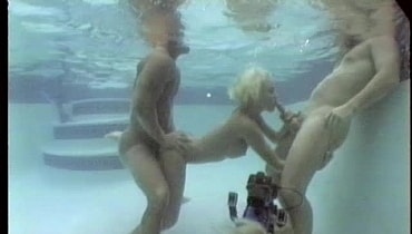 Ever horny Sandy Knight takes on two hard cocks after a day of underwater s...